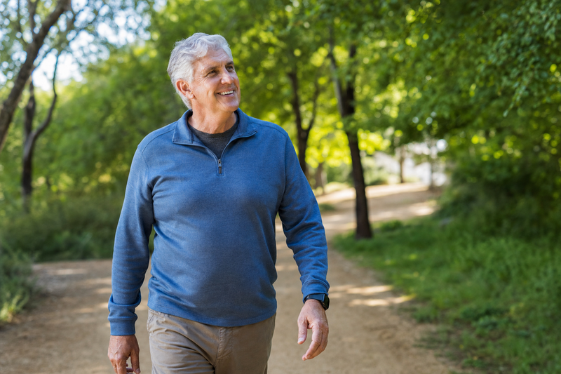Man enjoying the sounds of nature on a morning walk